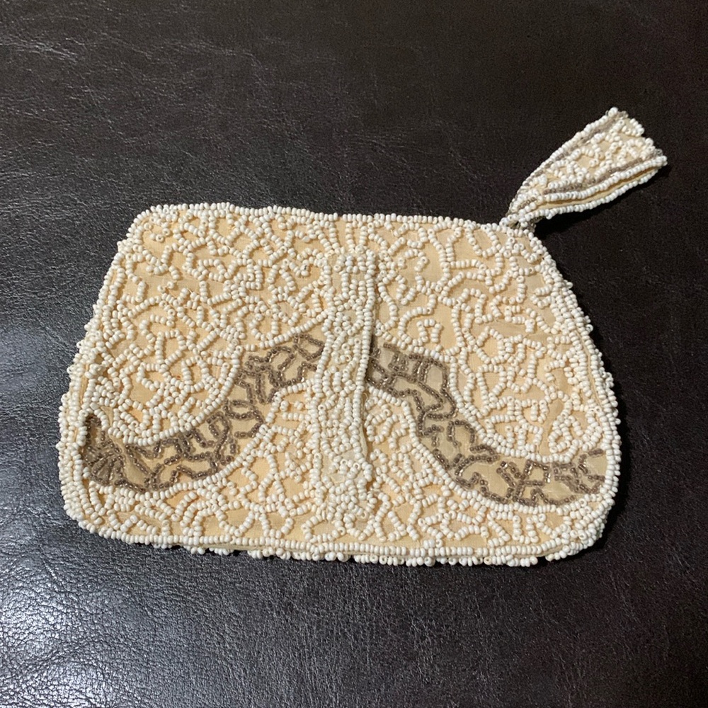 Elegant Cream Seed Beaded Clutch with Tassel Zipper closure.